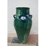 A floor standing drip glazed Sharab wine vessel. H.80xW.40cm