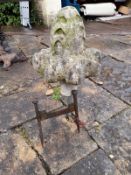 A carved stone Gothic style foliate finial along with a vintage iron boot scraper. H50cm, the finial