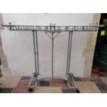 An unusual folding and mobile metal framed coat hanging rack on casters. H.160xW.35cm (closed)