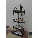 A wrought metal framed four tier corner whatnot with inlaid mosaic tiled shelves. H.138 x W.30cm