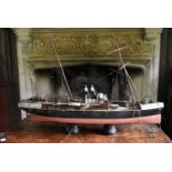 An early 20th century scratch built model of a steamer on stand. H.80xL.126cm