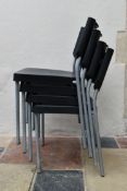 a set of four modern moulded stacking chairs on metal tubular bases. H.76x40x45cm