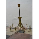 A large ten branch gilt metal ceiling chandelier with scrolling arms. H.117cm