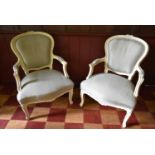 A pair of Louis XV style fauteuils with white painted frames in pale woven upholstery. H.95xW.
