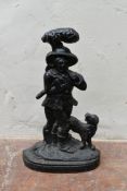 A vintage cast iron door stop in the shape of a 19th century huntsman. H.39cm