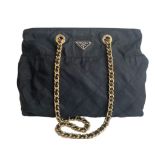 A Prada Tessuto black quilted nylon with gold hardware. W.36cm x H.27cm x D.10cm