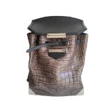 An Alexander Wang Prisma Skeletal Leather embossed Crocodile Backpack with silver hardware. Includes