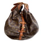 A Louis Vuitton Mahina XL Crocodile Trim Tote in Monogram canvas leather and gold hardware. Includes