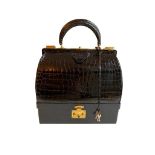 A Hermes Mallet Bag in black shiny Crocodile with gold hardware. Believed to be from the 1960's.