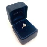 A Contemporary 0.70ct Tiffany Marquis diamond solitaire ring mounted in platinum. The central