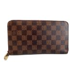 A Louis Vuitton Wallet Ebene in Damier Canvas, with zip. W.21cm