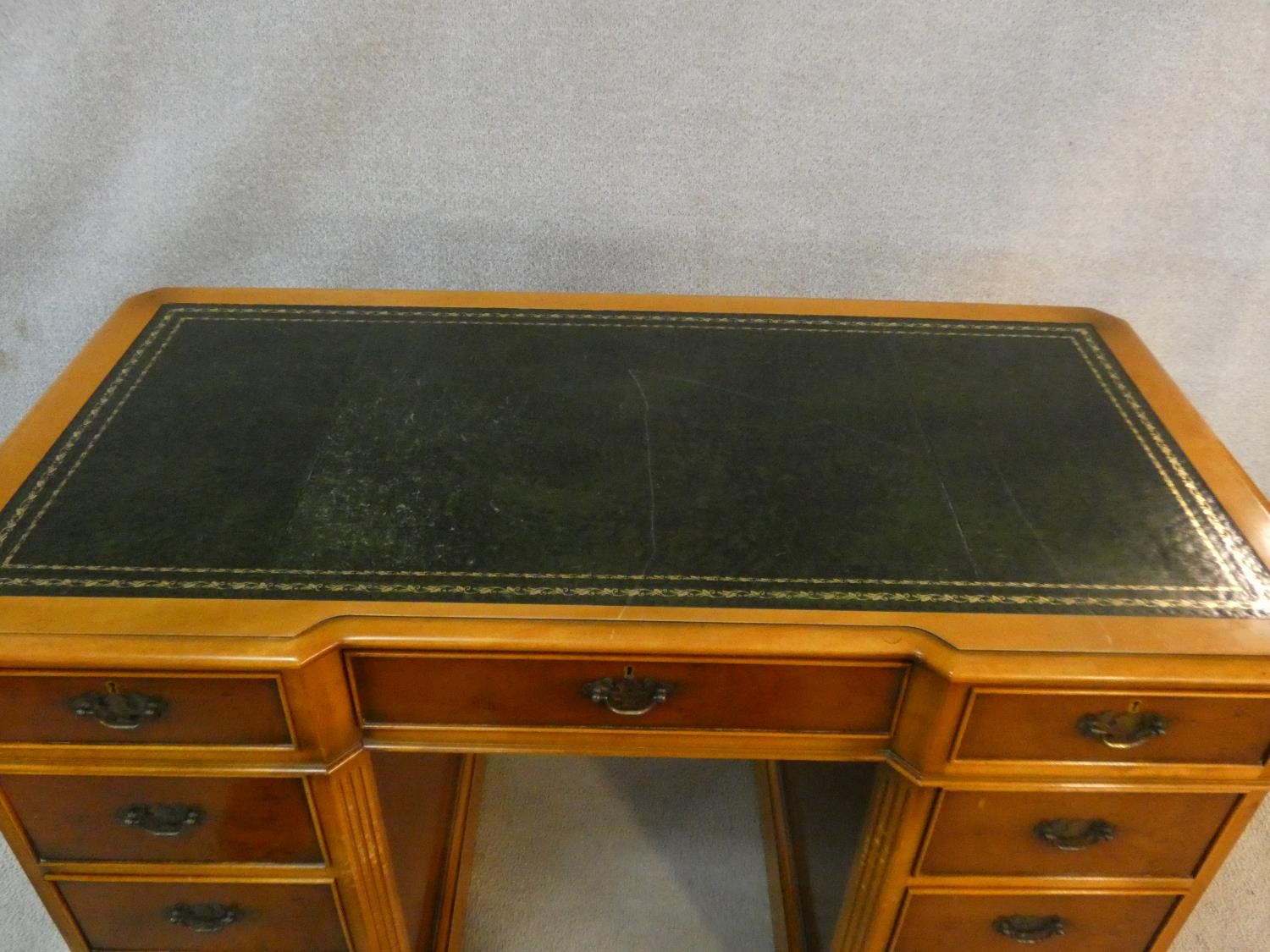 A Georgian style yew pedestal desk with inset tooled leather top above an arrangement of nine - Image 3 of 6