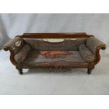 A Victorian mahogany framed double scroll end sofa with long squab cushion and end bolsters on