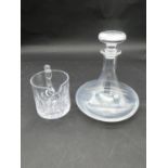 A cut crystal jug along with a crystal decanter with mushroom stopper. Engraved inscription. H.22cm