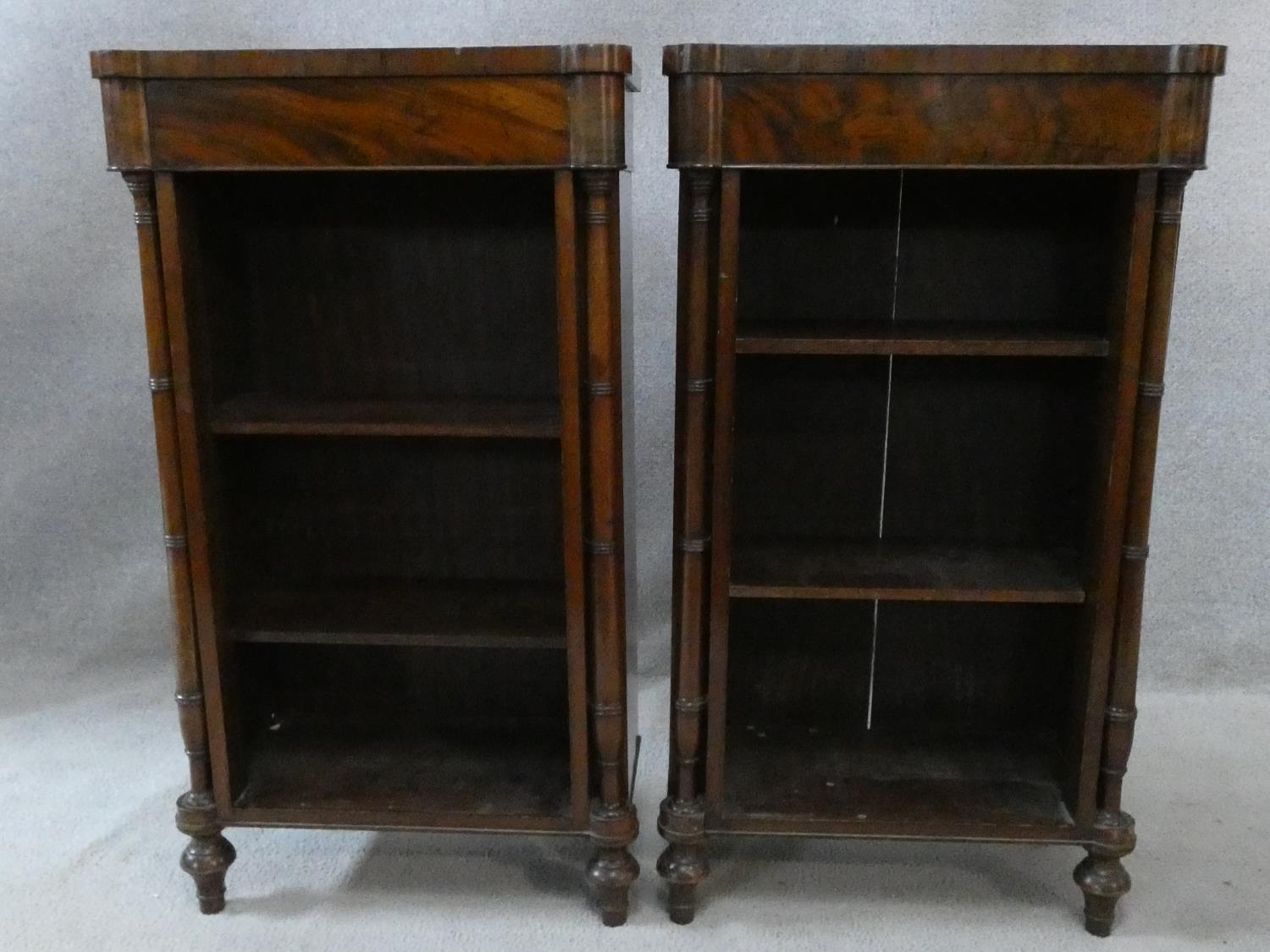 A pair of 19th century figured mahogany dwarf open bookcases fitted with adjustable shelves