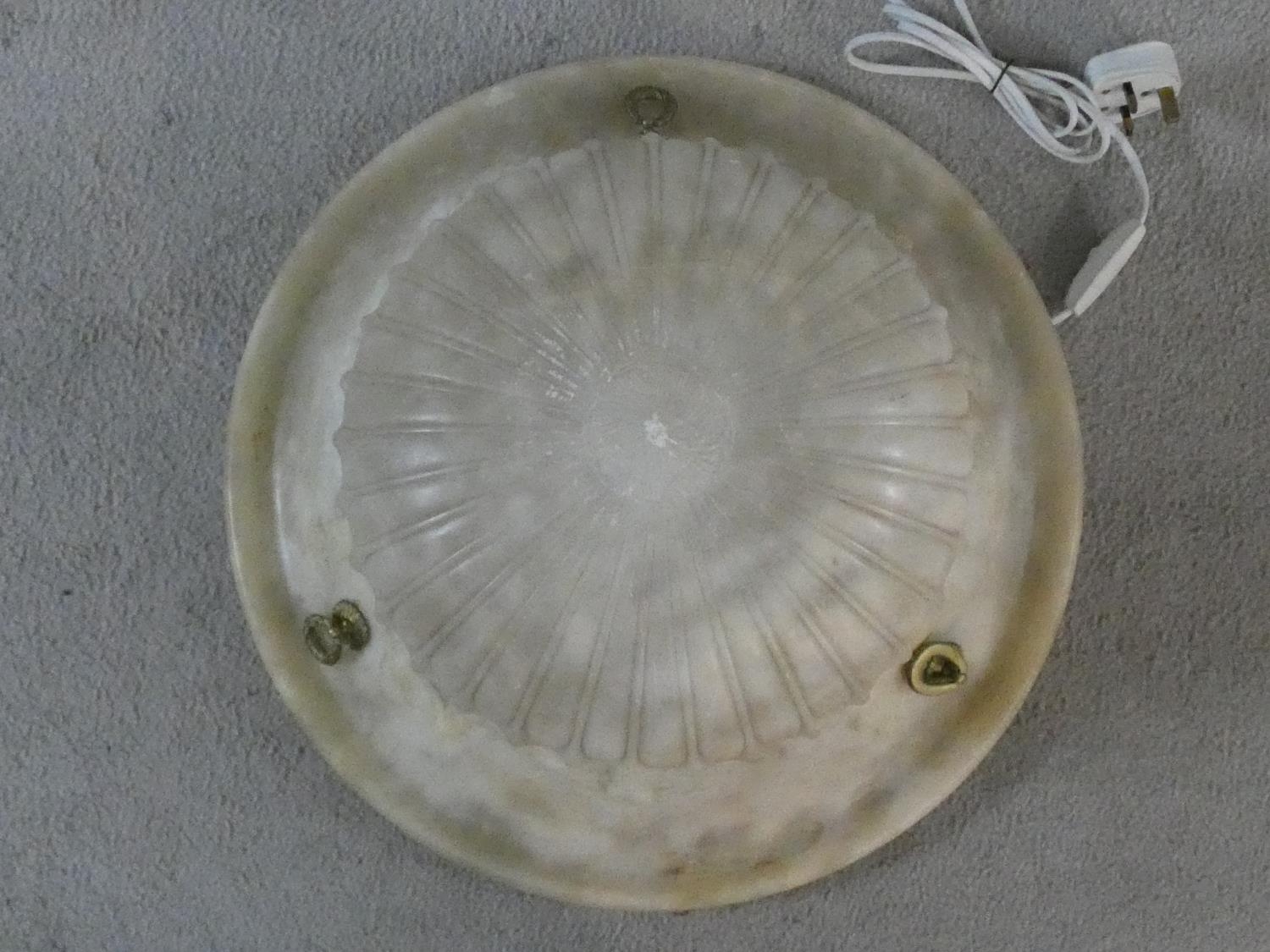 A carved alabaster ceiling light pendant shade of waisted ribbed form. H.19 D.46cm - Image 2 of 6