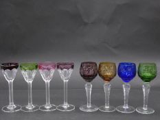 Eight antique Bohemian cut to clear sherry/cordial glasses. A set of four with vine design and