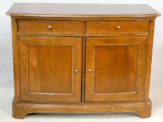 A Willis and Gambier French provincial style chestnut side cabinet of bowed outline fitted with