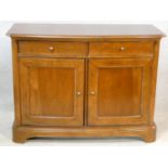 A Willis and Gambier French provincial style chestnut side cabinet of bowed outline fitted with