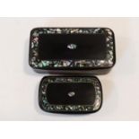 Two Victorian black papier-mâché snuff boxes inlaid with chips of abalone shell, and a shell border.