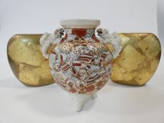 A vintage Satsuma ware lamp base with hand painted Japanese warriors and Foo dog handles, along with