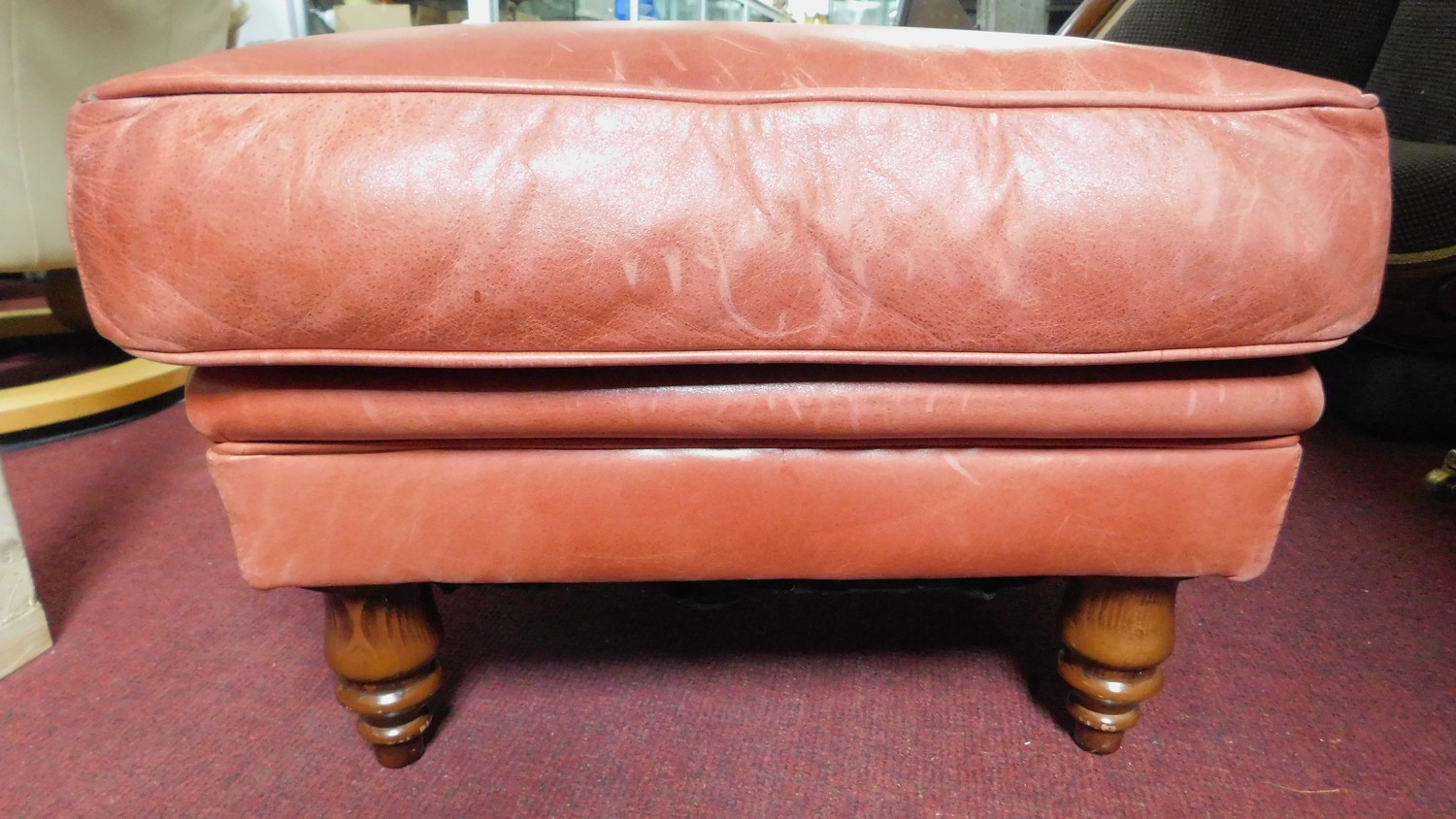 A leather upholstered footstool on turned tapering supports. H.37 W.58 D.58 - Image 2 of 2