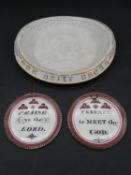 An antique gilded 'Give Us This Day Our Daily Bread' ceramic plate along with two Maling style