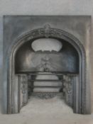 A Victorian cast iron fire insert. H.91 W.81cm