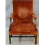 A 19th century mahogany Gainsborough armchair in velour upholstery on moulded square stretched