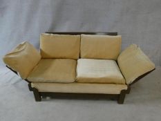 A mid century vintage teak framed Parker Knoll day bed with fully adjustable arms to each end. H.