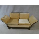 A mid century vintage teak framed Parker Knoll day bed with fully adjustable arms to each end. H.