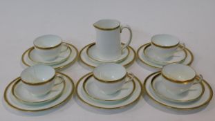 A Hammersly & Co gilded porcelain part five person coffee set. Decorated with a black and gold