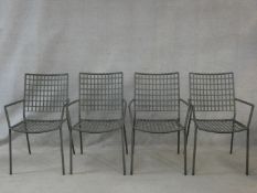 A set of four Emu metal framed stacking garden armchairs. H.89cm