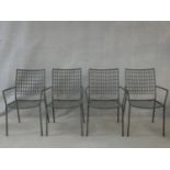 A set of four Emu metal framed stacking garden armchairs. H.89cm