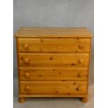 A Victorian style pine chest of four long drawers. H.85 W.87 D.44cm