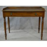 A 19th century mahogany writing table with raised superstructure and single drawer with original
