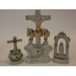 Two antique Staffordshire pearlware Holy Water stoops, with crucifixes and a Staffordshire pottery
