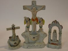 Two antique Staffordshire pearlware Holy Water stoops, with crucifixes and a Staffordshire pottery