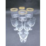 A collection of glasses. Including a set of five sherry glasses with gilded Orion symbols, along