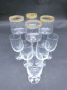 A collection of glasses. Including a set of five sherry glasses with gilded Orion symbols, along