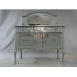 A mid century mirror backed sideboard with all over later painted decoration. H.150 W.122 D.47cm