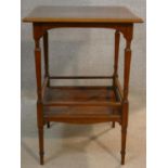 An Edwardian burr walnut and satinwood crossbanded occasional table on shaped tapering supports