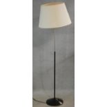 A 1960's vintage standard lamp in black metal and chrome. H.145cm