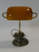 A Christopher Wray vintage style embossed brass desk lamp with amber glass shade. H.38cm