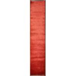A finely woven runner in plain iridescant deep red. L.290xW61cm