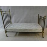 A Victorian brass bedstead made for James Shoolbred, to take a 3 ft mattress.