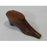 An antique wooden treen snuff box in the form of a heeled boot. Brass stud detailing to the boot