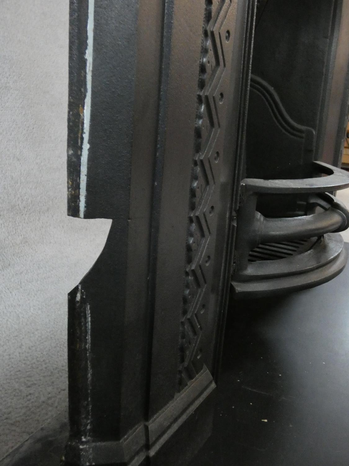 An ornately cast 19th century iron fire surround, mantel shelf and insert with grate on marble - Image 7 of 13