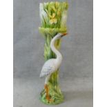 An Art Nouveau style Delphin Massier jardiniere on stand, heron and yellow flag iris, stamped D