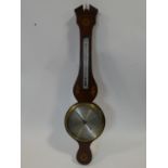 A George III mahogany banjo barometer inlaid with satinwood and olivewood oval shells and